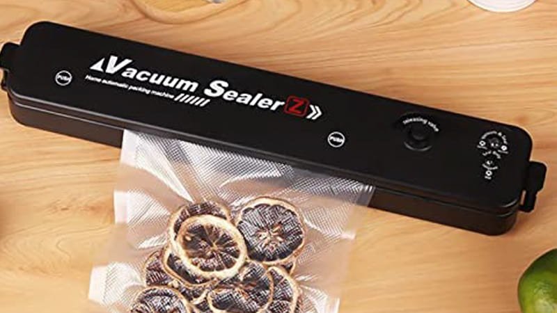 Person thoughtfully looking at different food products and then at a vacuum packaging machine specifications sheet