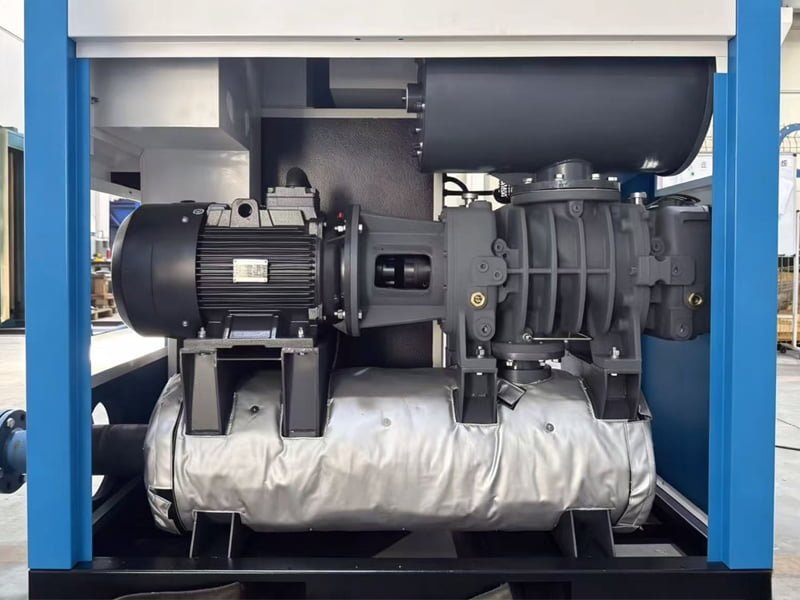 An overhead view of a complete oil-free screw blower skid with visible filter housing and acoustic panels